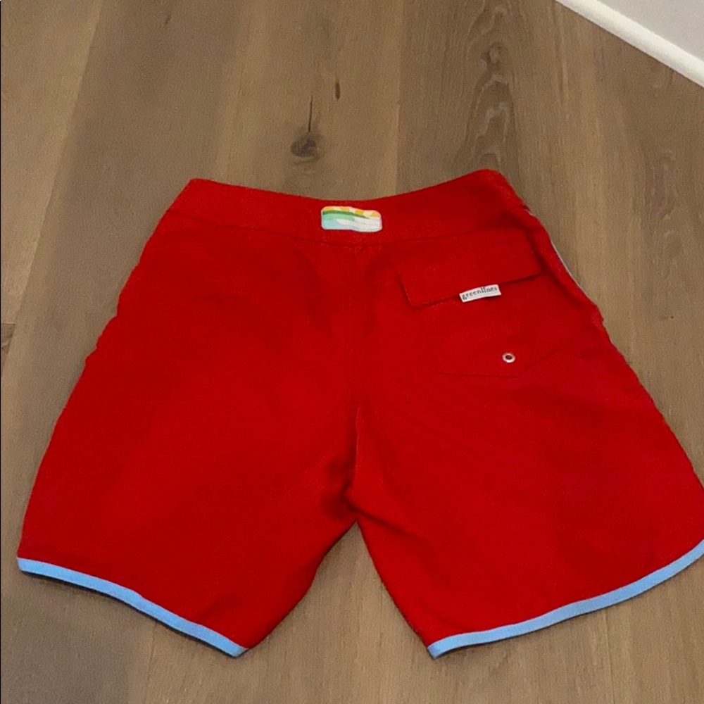 Red swim trunks with blue lining and pocket detail - Picture 2 of 4